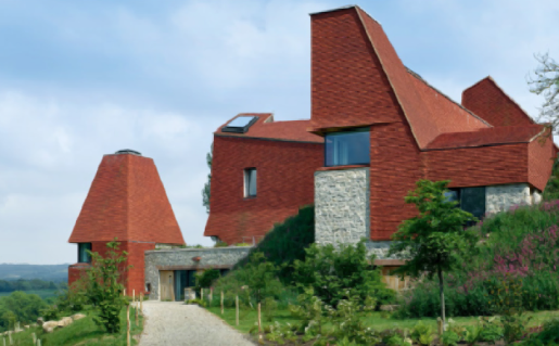 Caring Wood, Kent, begun in 2013 by James Macdonald Wright and Niall Maxwell, evokes the form of local oast houses