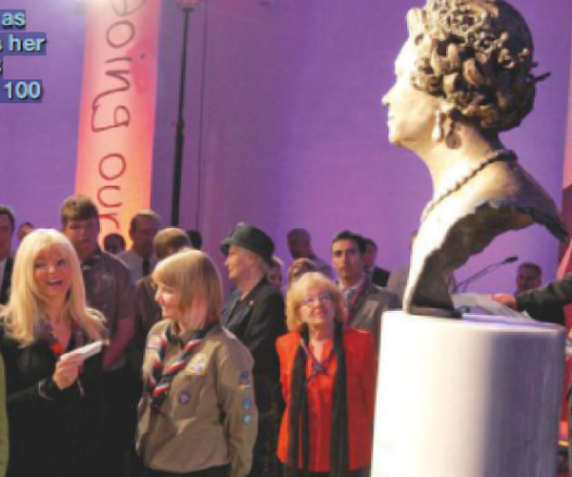 Frances watches as the Queen unveils her likeness at a 2008 event celebrating 100 years of Scouting