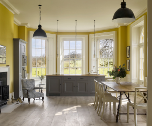 The spacious family kitchen in Regency idiom at Bighton Grange, Hampshire, 2017, designed by George Saumarez Smith